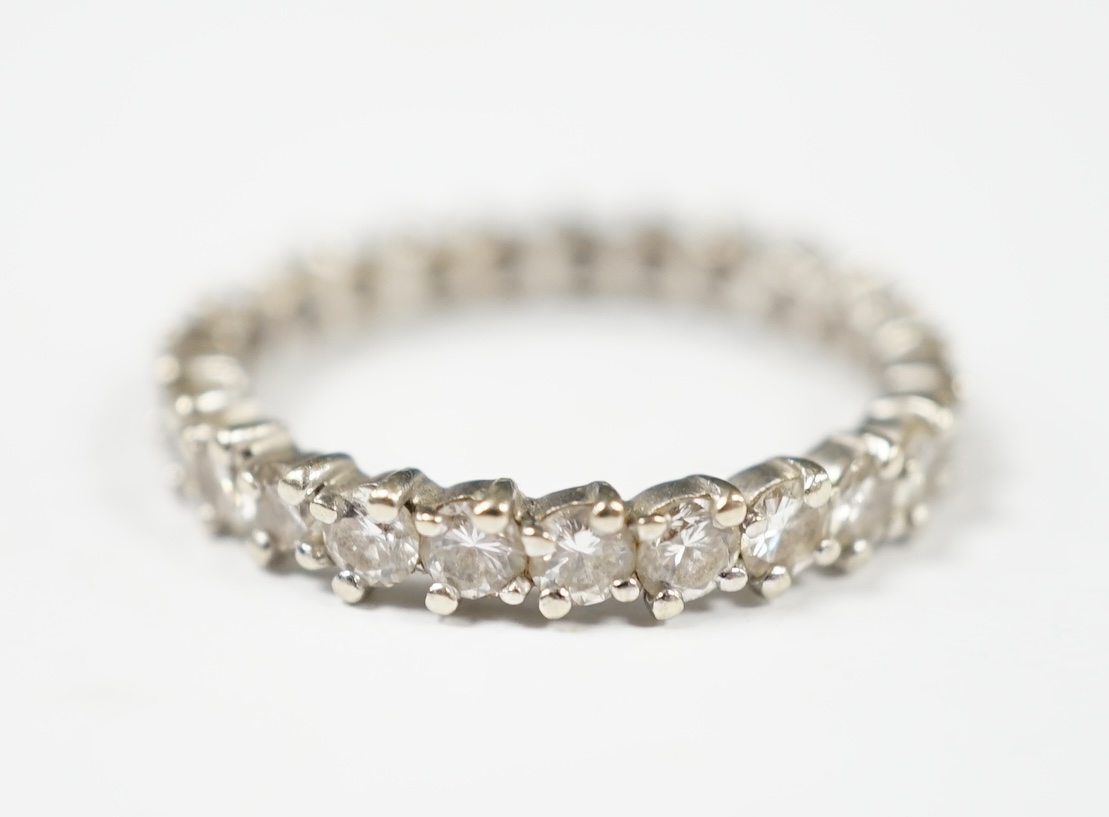 An early 20th century French 18k white gold and diamond set full eternity ring, size Q, gross weight 2.9 grams (stone missing). Condition - poor to fair